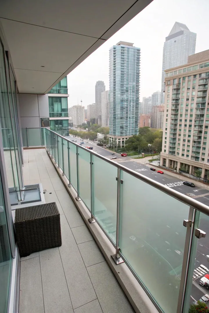 Modern glass railings provide sleek privacy.